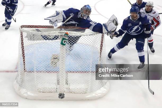 Andrei Vasilevskiy of the Tampa Bay Lightning reaches over the net to make a save against the Washington Capitals during the second period in Game...