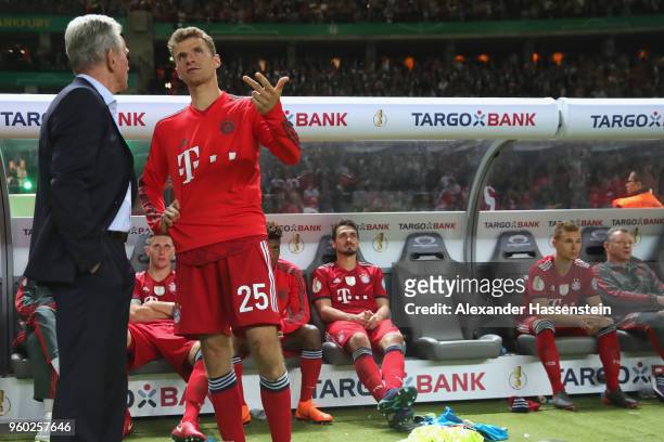 Thomas Mueller of Bayern Muenchen talks to his head coach Jupp Heynckes after losing the DFB Cup final against Eintracht Frankfurt at Olympiastadion...