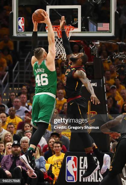 LeBron James of the Cleveland Cavaliers blocks a dunk by Aron Baynes of the Boston Celtics in the first half during Game Three of the 2018 NBA...