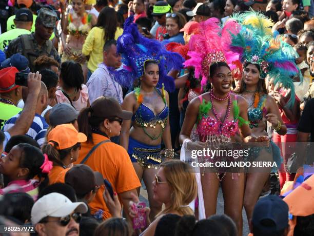 Dancers stop for a break during in the International Carnival of Friendship in La Ceiba, Honduran Caribbean, on May 19, 2018.