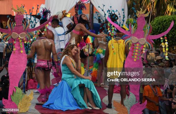 Members of the LGBT community parade atop a float during the International Carnival of Friendship in La Ceiba, Honduran Caribbean, on May 19, 2018.