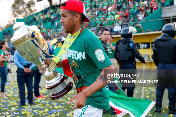 Marathon's Jaudel Laera celebrates with the trophy after defeating Motagua to win the Honduran Clausura Tournament at the Yankel Rosenthal stadium in...