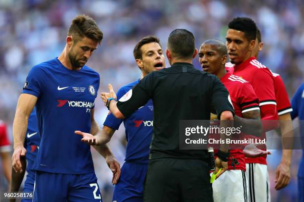 Players talk to Referee Michael Oliver after he gave a penalty during the Emirates FA Cup Final between Chelsea and Manchester United at Wembley...