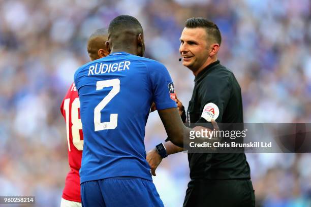 Antonio Rudiger of Chelsea talks with Referee Michael Oliver during the Emirates FA Cup Final between Chelsea and Manchester United at Wembley...