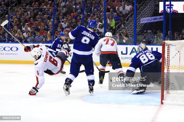 Andrei Vasilevskiy of the Tampa Bay Lightning tends goal as Michal Kempny of the Washington Capitals falls to the ice during the third period in Game...