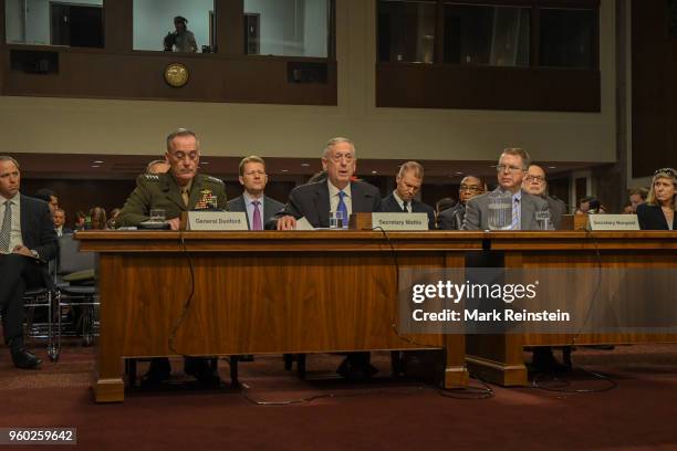 View of, from fore left, American military commander and Chariman of the Joint Chiefs of Staff General Joseph Dunford, Secretary of Defense Jim...