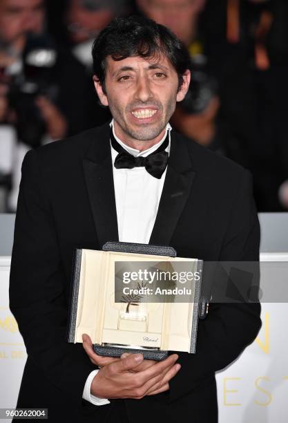 Actor Marcello Fonte poses with the Best Actor award for his role in 'Dogman' during the photocall at the 71st Cannes Film Festival in Cannes, France...