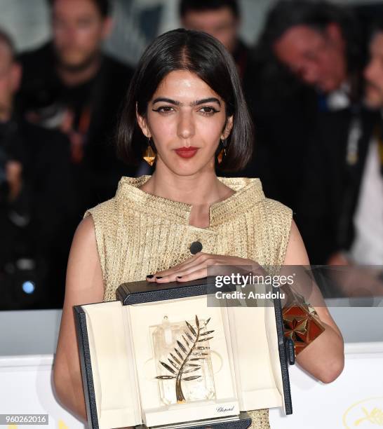 Actress Solmaz Panahi, daughter of Jafar Panahi, poses with the Best Screenplay prize for the film '3 Faces at the 71st Cannes Film Festival in...