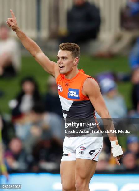 Zac Langdon of the Giants celebrates a goal during the 2018 AFL round nine match between the North Melbourne Kangaroos and the GWS Giants at...