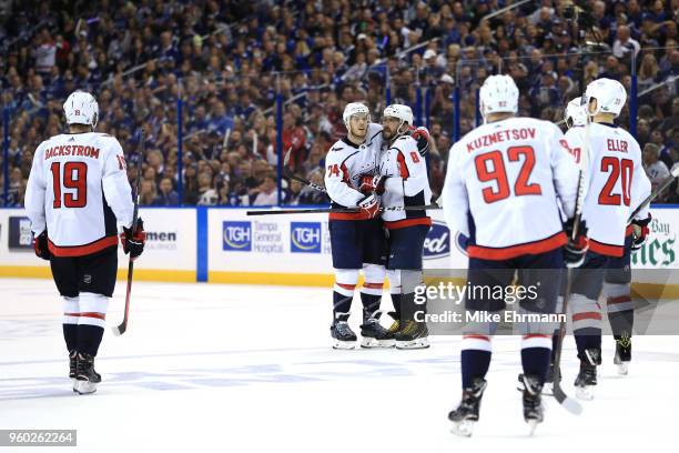 Alex Ovechkin of the Washington Capitals celebrates with his teammates after scoring a goal on Andrei Vasilevskiy of the Tampa Bay Lightning during...