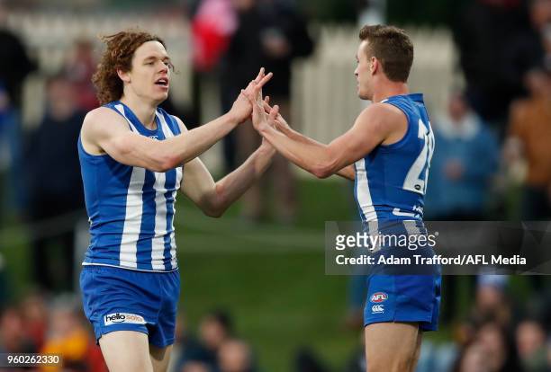 Ben Brown of the Kangaroos celebrates a goal with Kayne Turner of the Kangaroos during the 2018 AFL round nine match between the North Melbourne...