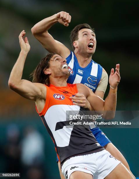 Ryan Griffen of the Giants and Sam Wright of the Kangaroos compete for the ball during the 2018 AFL round nine match between the North Melbourne...