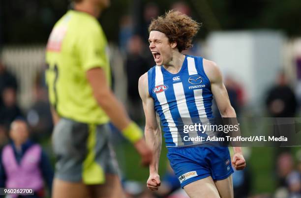 Ben Brown of the Kangaroos celebrates a goal during the 2018 AFL round nine match between the North Melbourne Kangaroos and the GWS Giants at...