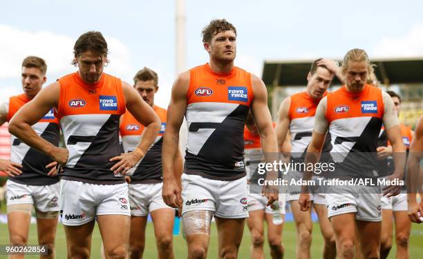 Sam Reid of the Giants is seen injured during the 2018 AFL round nine match between the North Melbourne Kangaroos and the GWS Giants at Blundstone...