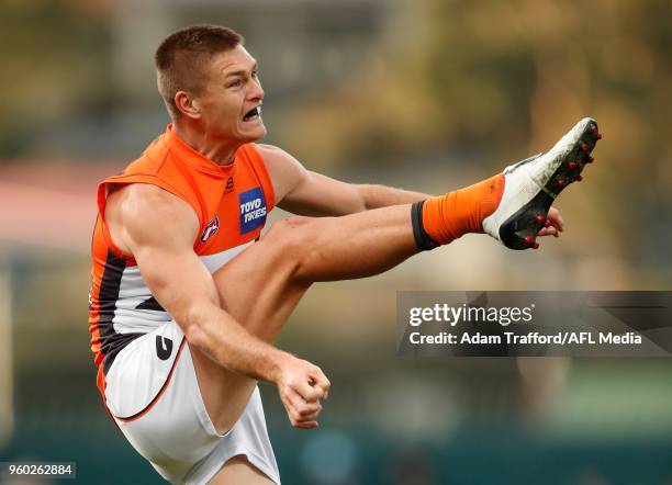 Adam Tomlinson of the Giants kicks the ball in his 100th game during the 2018 AFL round nine match between the North Melbourne Kangaroos and the GWS...