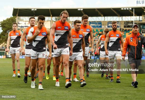 Giants players look dejected after a loss during the 2018 AFL round nine match between the North Melbourne Kangaroos and the GWS Giants at Blundstone...