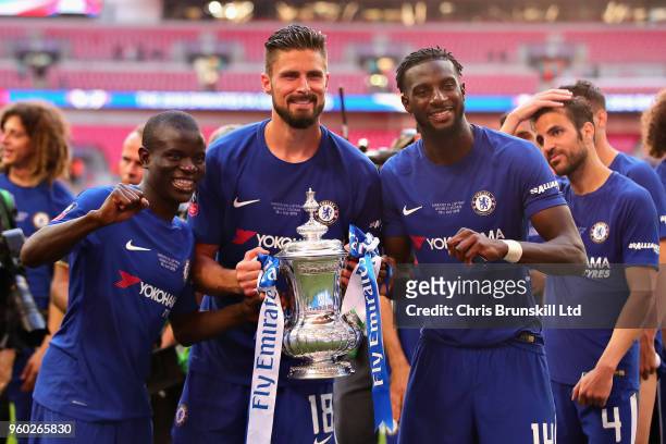 Golo Kante, Olivier Giroud and Tiemoue Bakayoko, all of Chelsea, celebrate with the FA Cup trophy after the Emirates FA Cup Final between Chelsea and...