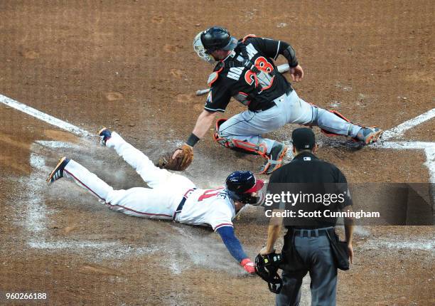 Ender Inciarte of the Atlanta Braves scores a fifth inning run against Bryan Holaday of the Miami Marlins at SunTrust Field on May 19, 2018 in...