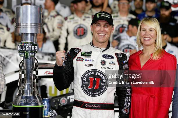 Kevin Harvick, driver of the Jimmy John's Ford, celebrates with his wife, DeLana, iin Victory Lane after winning the Monster Energy NASCAR Cup Series...