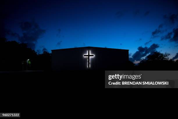 Church is seen near Santa Fe High School a day after a mass shooting May 19, 2018 in Santa Fe, Texas. - Ten people, mostly students, were killed when...