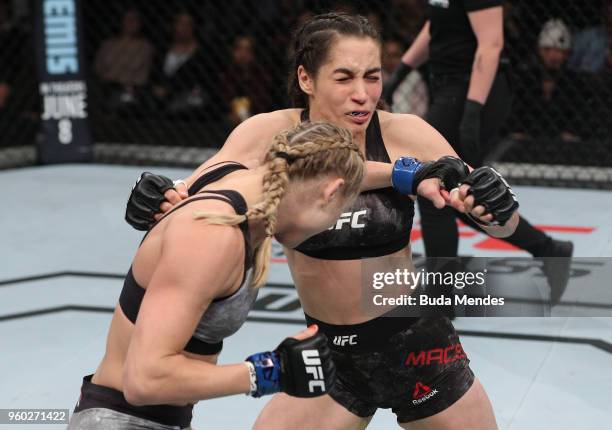 Andrea Lee punches Veronica Macedo of Venezuela in their women's flyweight bout during the UFC Fight Night event at Movistar Arena on May 19, 2018 in...