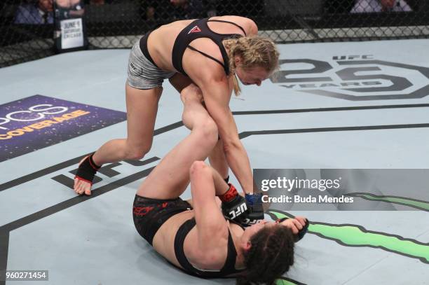 Andrea Lee punches Veronica Macedo of Venezuela in their women's flyweight bout during the UFC Fight Night event at Movistar Arena on May 19, 2018 in...