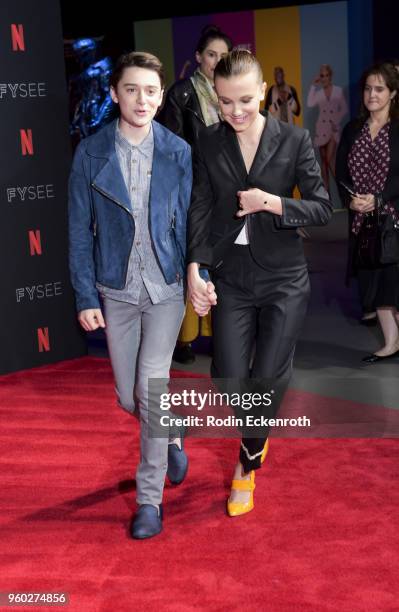Actress Millie Bobby Brown and Noah Schnapp arrive at the #NETFLIXFYSEE event for "Stranger Things" at Netflix FYSEE at Raleigh Studios on May 19,...