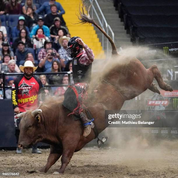 Justin Lloyd rides Like A G6 during the PBR Monster Energy Tour Professional Bull Riders event on May 19, 2018 at the Centre Videotron in Quebec...