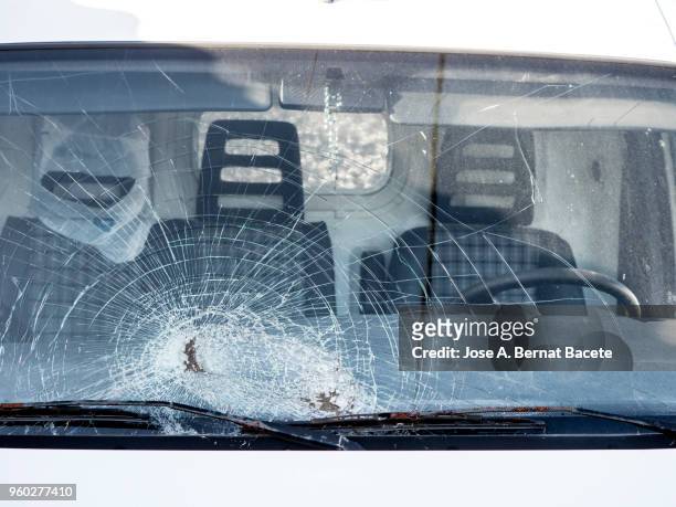 shattered windshield after car crash. vehicle accident. broken glass. - dented stock pictures, royalty-free photos & images