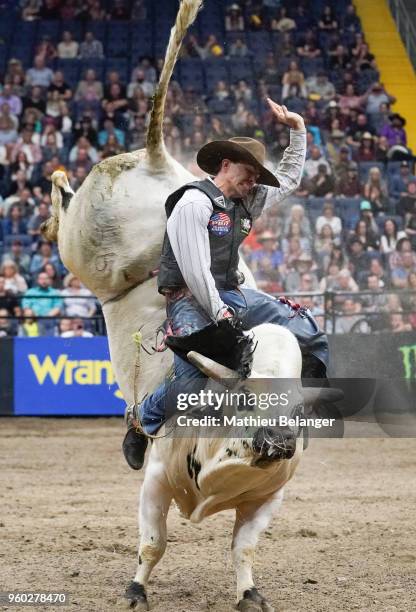 Justin Lachlan Richardson rides Mr Legit during the PBR Monster Energy Tour Professional Bull Riders event on May 19, 2018 at the Centre Videotron in...