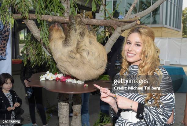 Singer Hayley Reinhart poses with Charlie the Sloth at the Greater Los Angeles Zoo Association's 2018 Beastly Ball at Los Angeles Zoo on May 19, 2018...