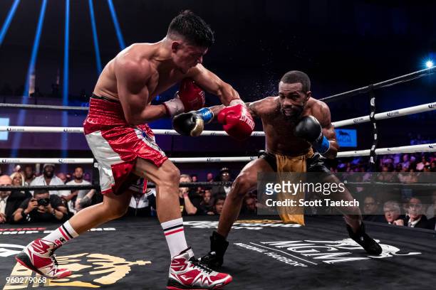 Gary Russell Jr. And Joseph Diaz Jr. Trade punches during the 12th round of the WBC featherweight title bout at MGM National Harbor on May 19, 2018...