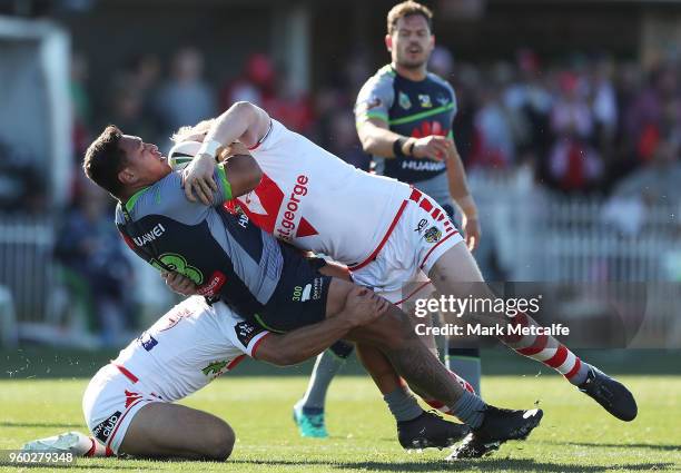 Josh Papalii of the Raiders is tackled by James Graham of the Dragons during the round 11 NRL match between the St George Illawarra Dragons and the...