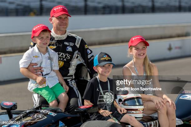 Ed Carpenter, driver of the Ed Carpenter Racing Chevrolet, poses with family after qualifying for the Indianapolis 500 on May 19 at the Indianapolis...