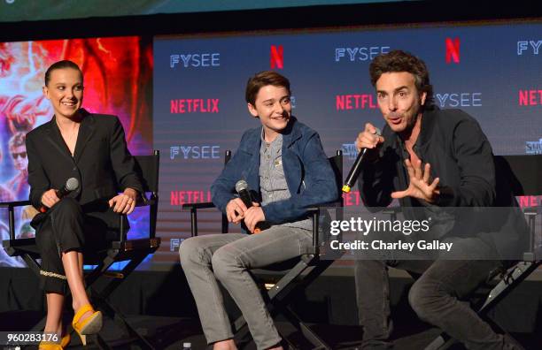 Millie Bobby Brown, Noah Schnapp and Director Shawn Levy speak onstage at The "Stranger Things 2" Panel At Netflix FYSEE on May 19, 2018 in Los...