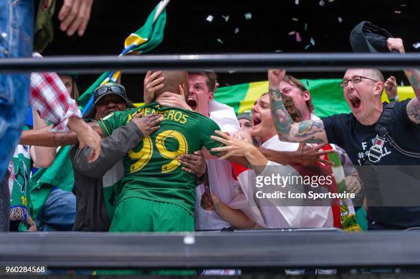 Portland Timbers forward Samuel Armenteros celebrates his goal by climbing to the Timbers Army supporters group platform during the second half of...