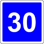 Road sign with suggested speed of 30 km/h