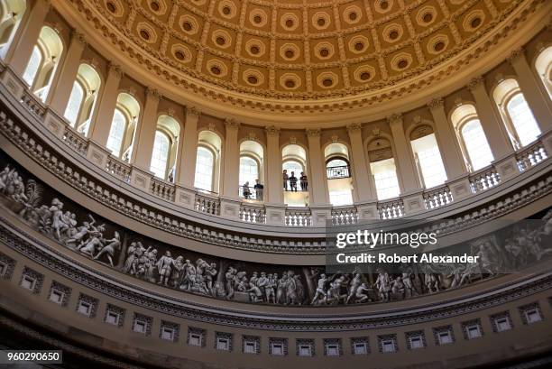 Tourists enjoy the view of the Rotunda below from the inner dome of the U.S. Capitol in Washington, D.C.