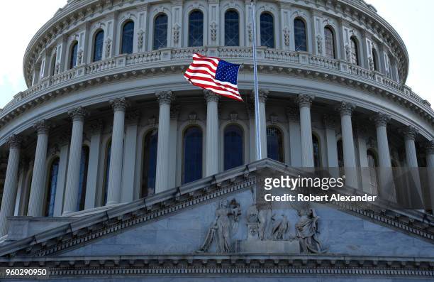 Flag flies in front of the U.S. Capitol in Washington, D.C. The flag flies at half-mast in honor of former First Lady Barbara Bush who died days...