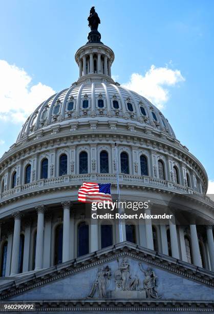 Flag flies in front of the U.S. Capitol in Washington, D.C. The flag flies at half-mast in honor of former First Lady Barbara Bush who died days...