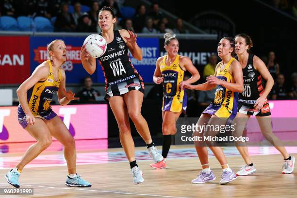 Madi Robinson of the Magpies gathers the ball during the round four Super Netball match between the Magpies and the Lightning at Margaret Court Arena...