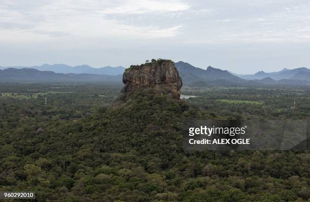 This photo taken on May 17, 2018 shows the ancient rock fortress of Sigiriya in north central Sri Lanka. - The rock fortress, a UNESCO world heritage...