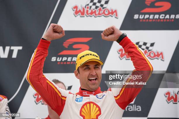 1st place Fabian Coulthard driver of the Shell V-Power Racing Team Ford Falcon FGX celebrates on the podium during race 14 for the Supercars Winton...