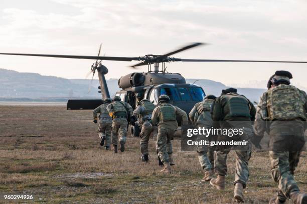 turkish army soldiers boarding military helicopter - infantry stock pictures, royalty-free photos & images