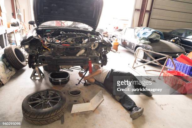 auto repair garage with mechanic - disassembled stock pictures, royalty-free photos & images