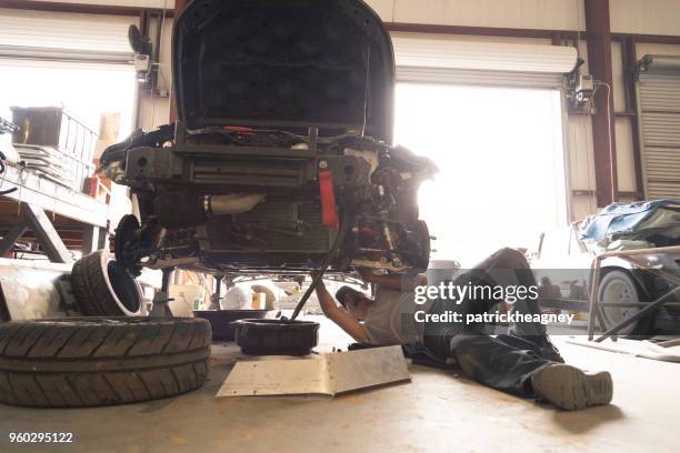 auto repair garage with mechanic - disassembling stock pictures, royalty-free photos & images