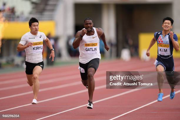 Yoshihide Kiryu of Japan, Justin Gatlin of the United States and Kim Kukyoung of South Korea compete in the Men's 100m during the IAAF Golden Grand...