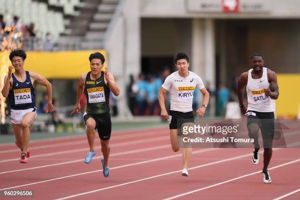 Ryohei Tada of Japan, Ryota Yamagata of Japan, Yoshihide Kiryu of Japan and Justin Gatlin of the United States compete in the Men's 100m during the...