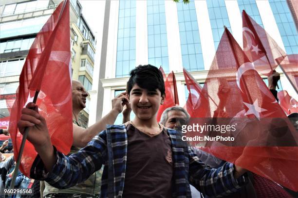 Young man holding Turkish flags poses for a photo during a demonstration staged by the main opposition Republican People's Party , protesting the...