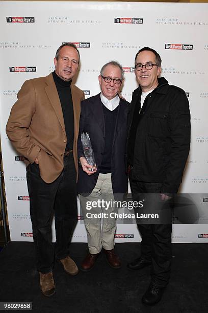 The Hollywood Reporter publisher Eric Mika, Focus Features CEO/Indie Icon Award recipient James Schamus and Sundance Film Festival Director John...